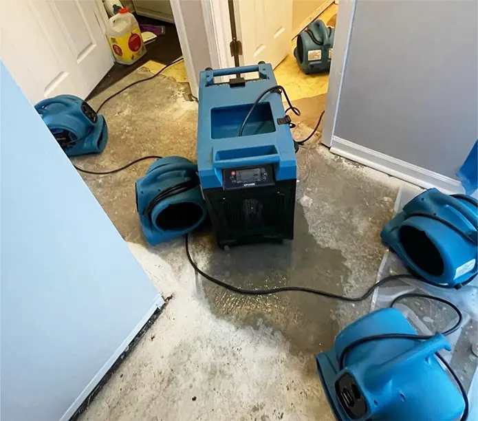 Air movers drying a room after a water loss in Sun City, CA