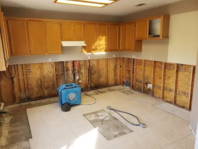 An appliance supply line leak behind an appliance in a Sun City, CA home